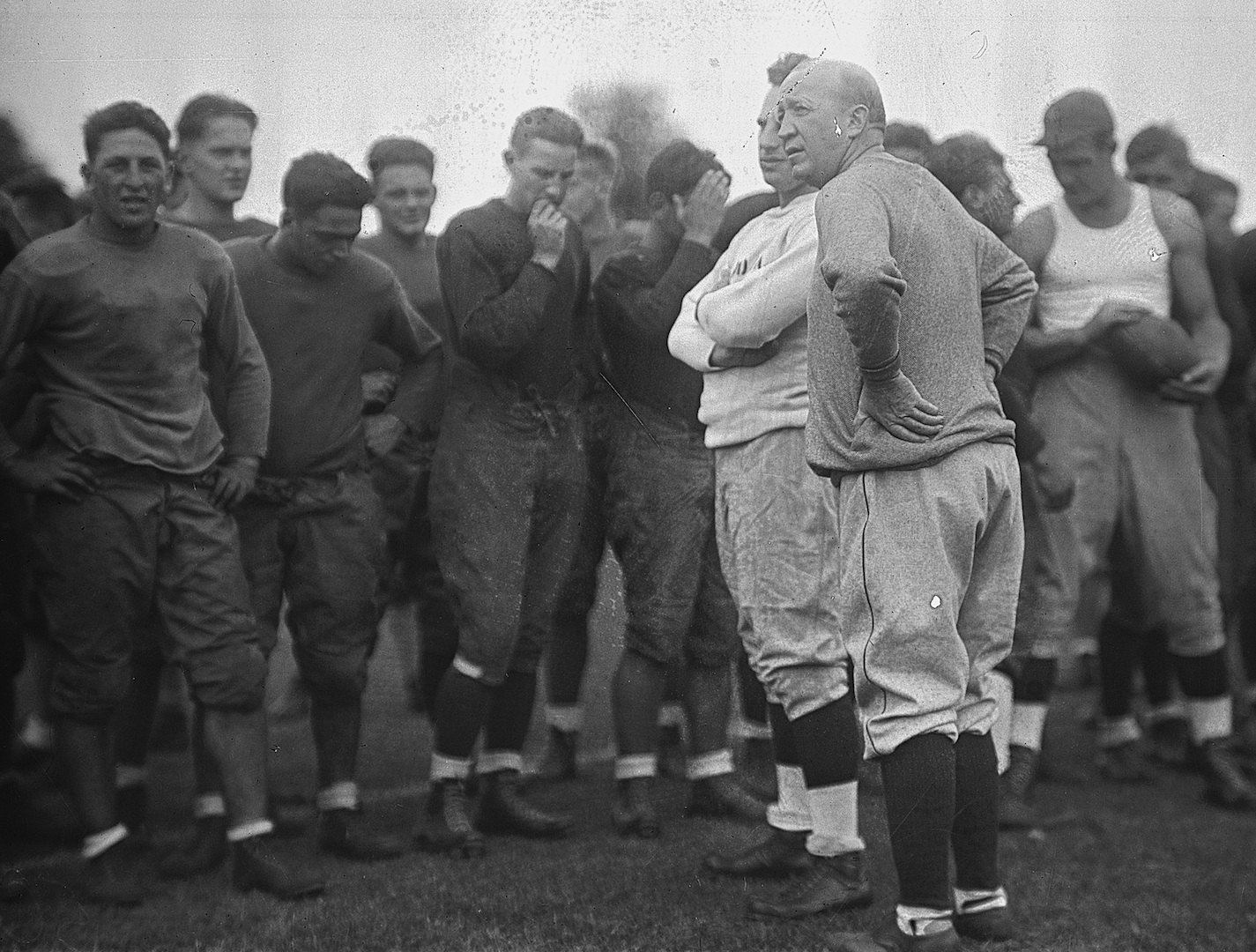 GBBY 45G/0382: Football Coach Knute Rockne at practice with players, c1920s.